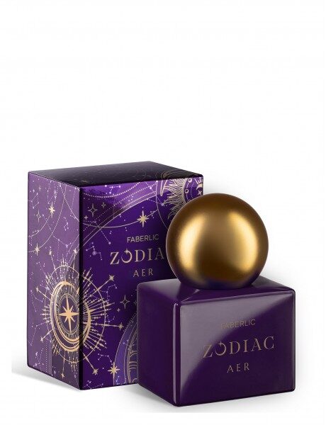 Купить Флакон FABERLIC ZODIAC AER с фиолетовыми гранями и золотым округлым элементом на фоне коробки с космическим принтом из каталога Фаберлик.