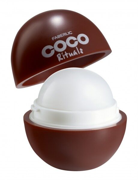 Купить Футляр Faberlic Coco Rituals в виде кокоса с белым бальзамом для губ внутри и коричневой крышкой на белом фоне. из каталога Фаберлик.